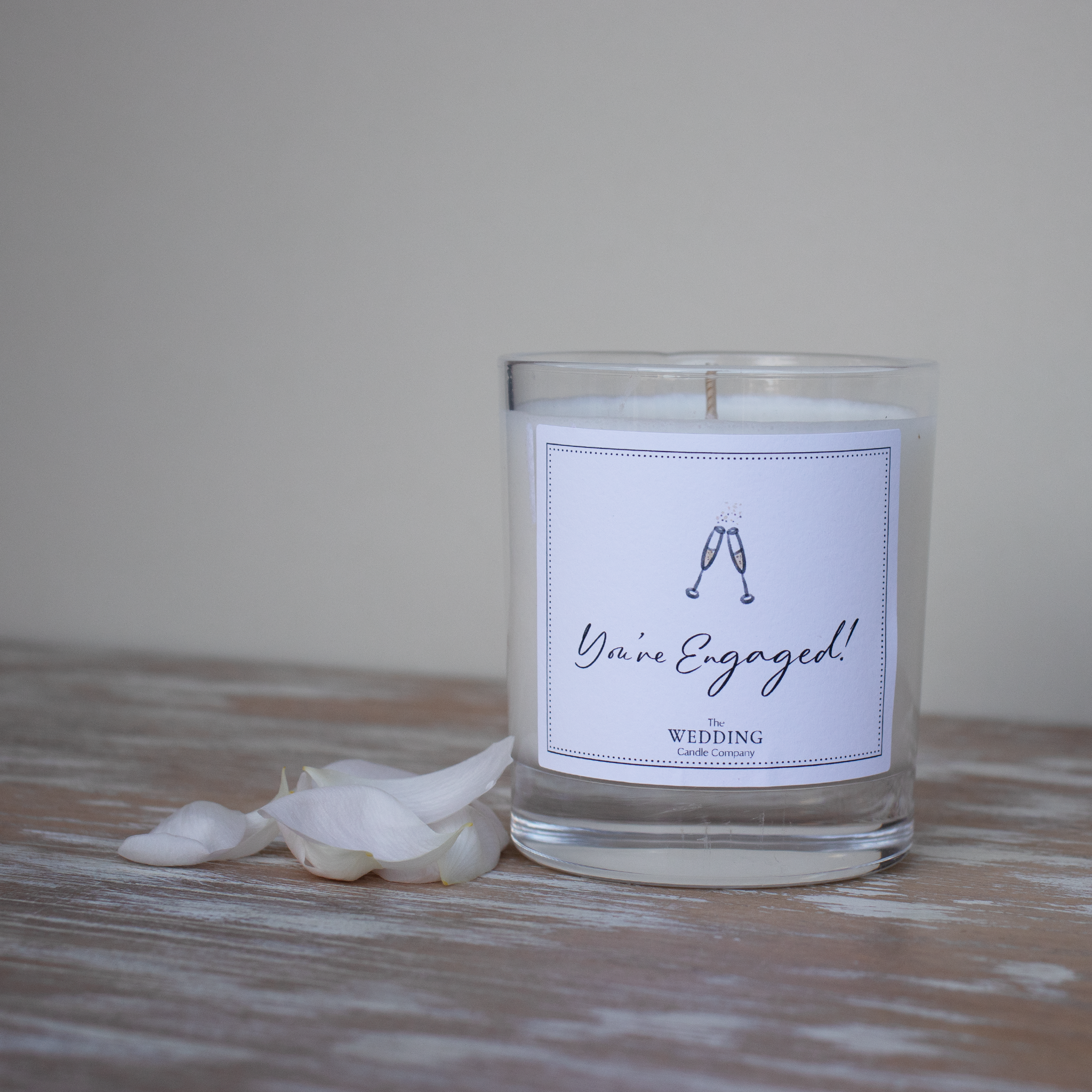 Personalised engagement gift. Champagne glasses, wedding candle. The Wedding Candle Company.